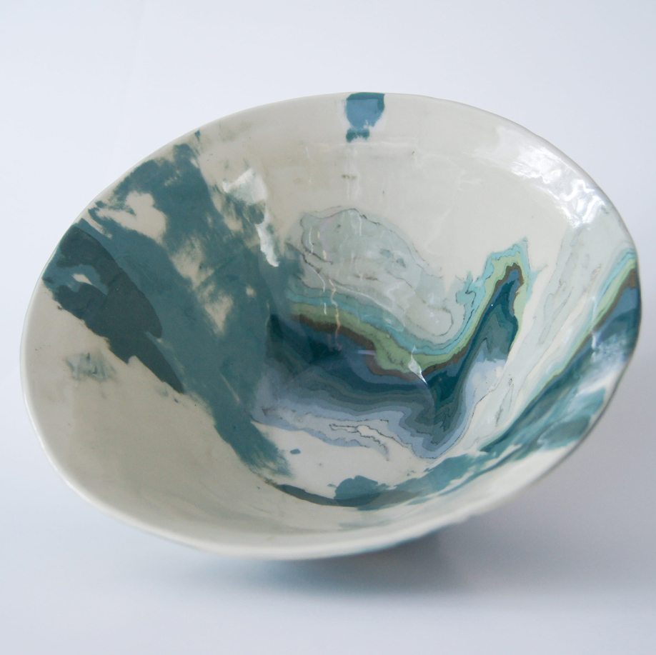 Photo of pottery bowl in swirls of white, blue, and green