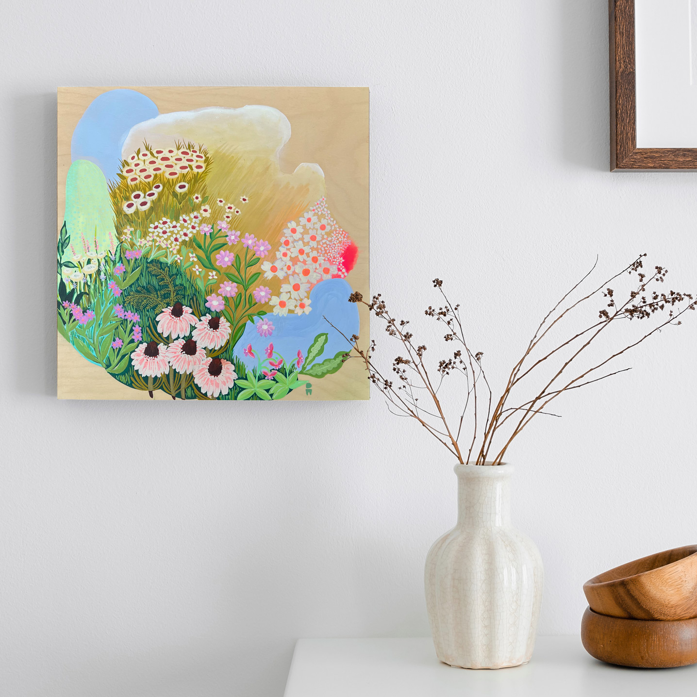 Photo of colourful painting on wall depicting wildflowers on an abstract background