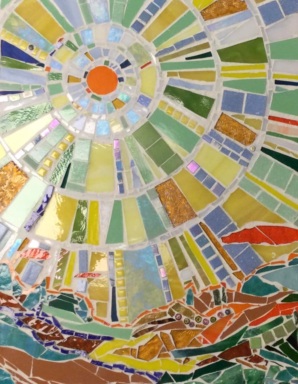 mosaic art showing sun rising over ocean