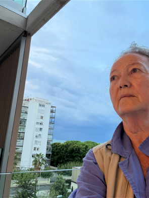 Photo of Nancy Doubleday on apartment balcony